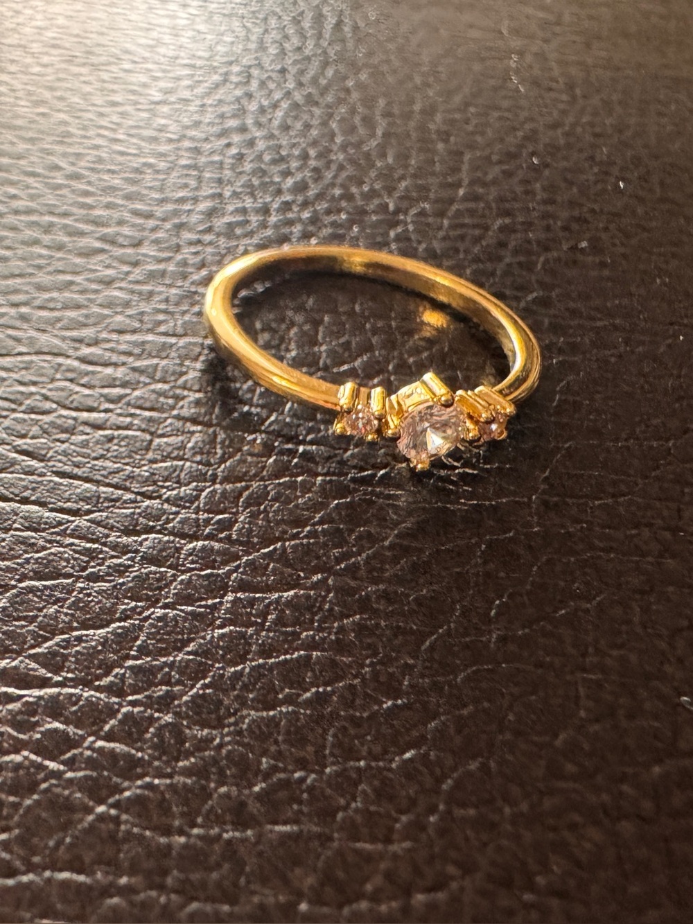 Delicate Gold tone Ring with Sparkling Center Stone “No, it’s not real gold.”